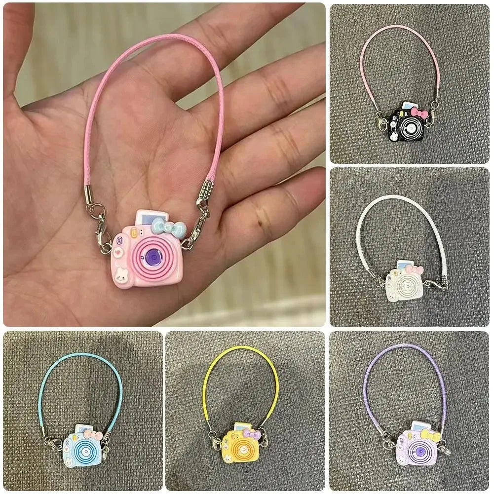 A collection of mini plush camera doll accessories in various colors and styles for a 17cm Labubu figure.