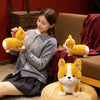 A young woman is holding a yellow Corgi plush toy while sitting on a floor mat.