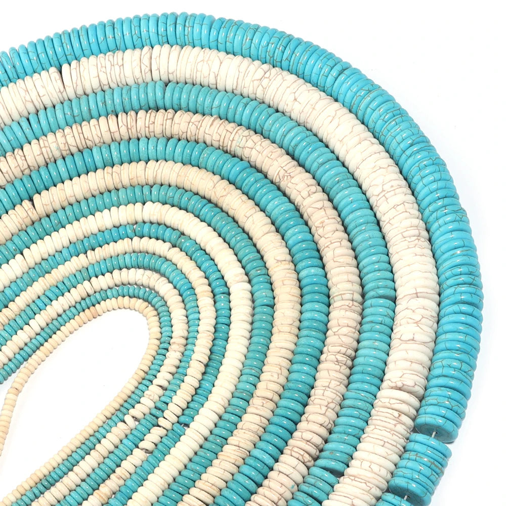 A close-up of natural turquoise stone beads arranged in a spiral pattern for jewelry making.