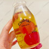 A clear bottle filled with yellow liquid and a red fruit, used as a drink cup toy.