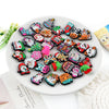 A collection of festive Christmas silicone beads in various colors and designs for jewelry making