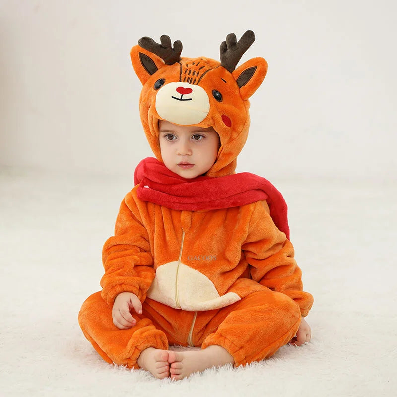 A baby wearing an adorable orange fox hooded romper with black antlers and a red scarf.