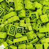 A pile of bright lime green plastic building blocks.