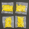 Several small plastic bags filled with yellow silicone finger ring launcher fidget toys