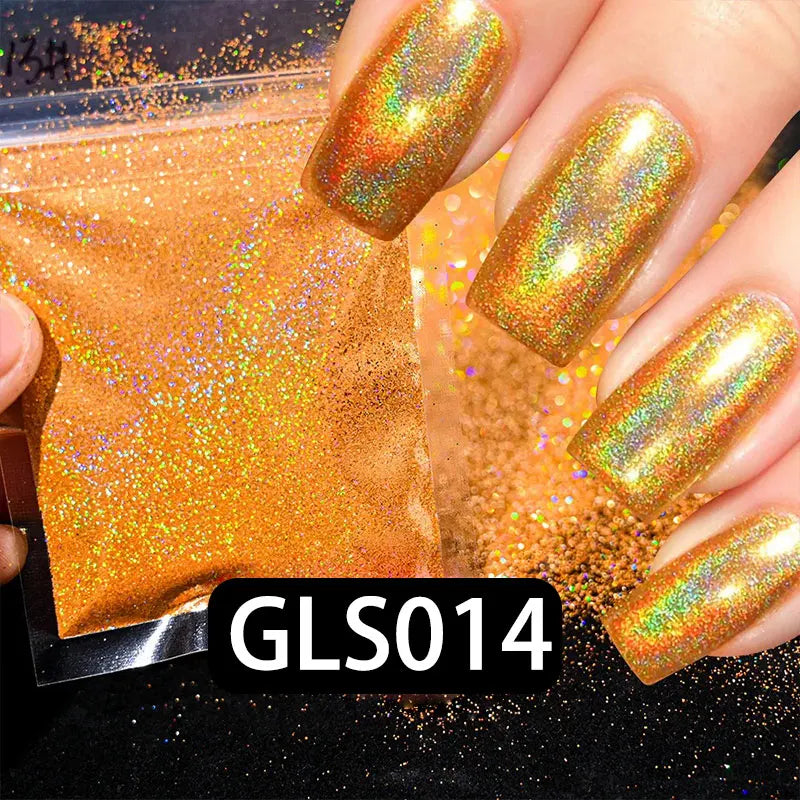 A hand displays a holographic rainbow nail glitter polish, GLS014, on a fingernail against a background of loose glitter.