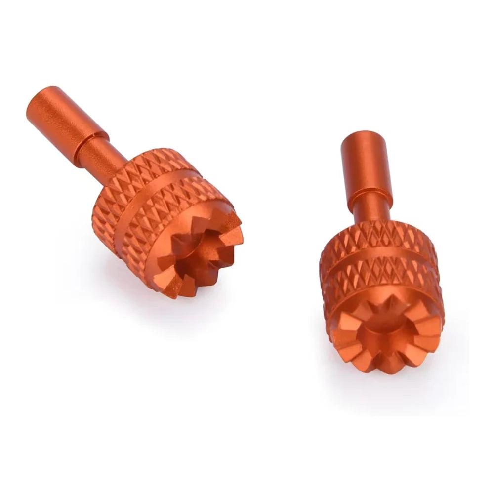 Two precision CNC aluminum joystick thumb sticks in a copper-orange color.