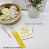 A set of crochet hooks, stitch markers, and needles with various colors displayed next to a woven basket and a white vase.