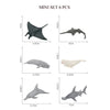A set of six mini ocean animal figurines including a whale, shark, dolphin, turtle, and penguin.