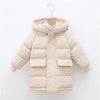 A beige kids' thick cotton-padded parka jacket with a hood hanging on a hanger.