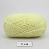 A ball of pale yellow pre-dyed milk cotton yarn used for knitting and crochet.