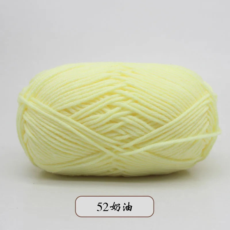 A ball of pale yellow pre-dyed milk cotton yarn used for knitting and crochet.