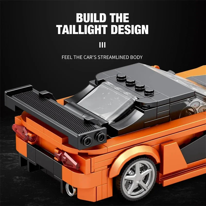 A building block set of a classic orange sports car model showing the taillight design detail.