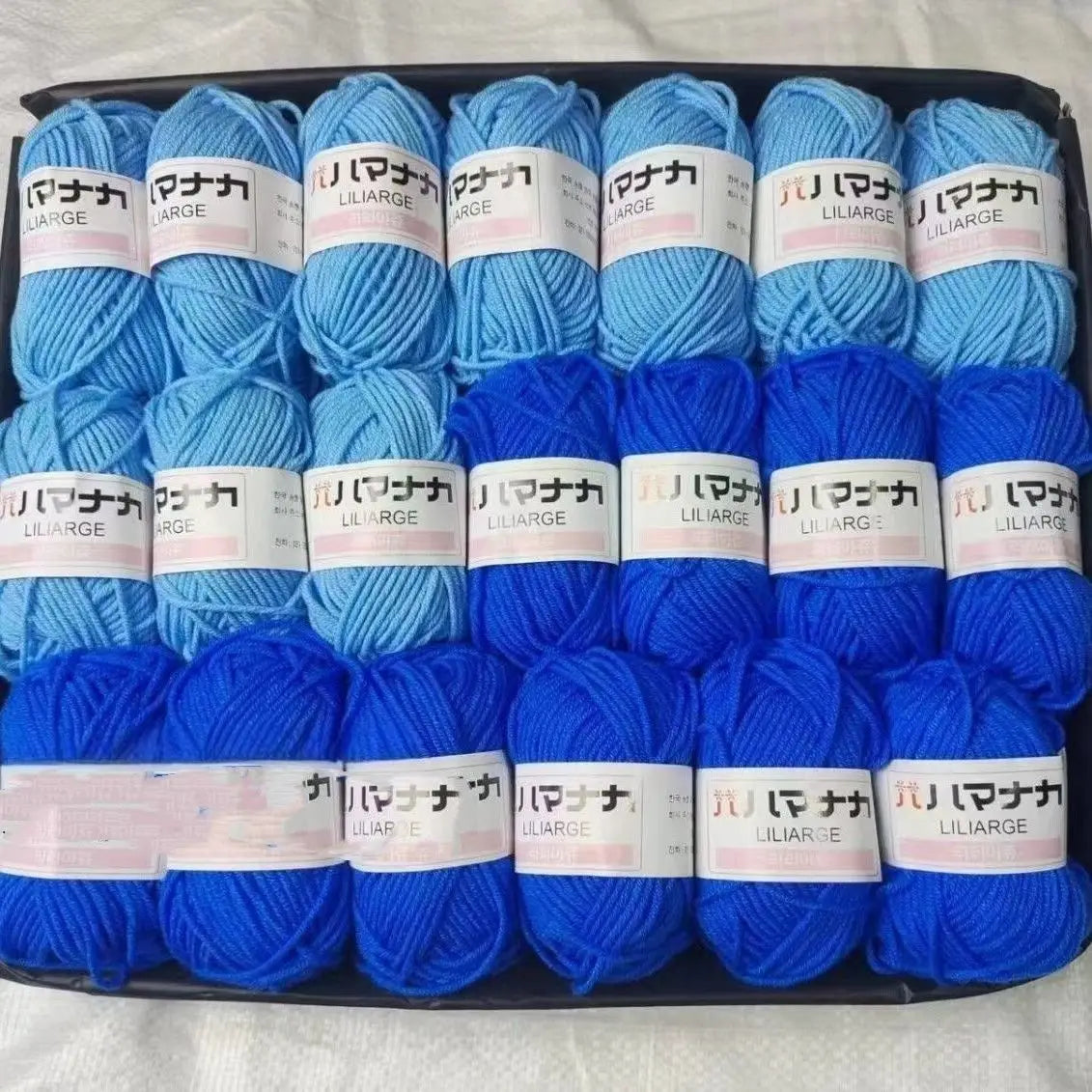 A pack of blue and purple acrylic yarn skeins labeled LILIARGE for knitting and crochet crafts.