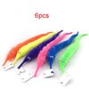 Six colorful magical trick bags or streamers arranged diagonally on a white background.