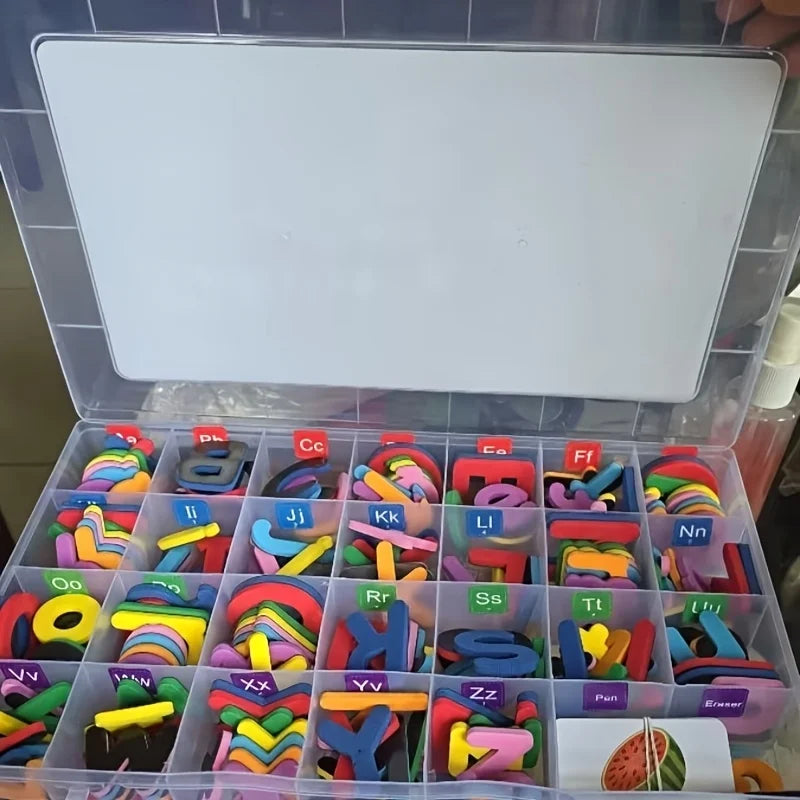 An open plastic box filled with various colored magnetic letters and alphabet toys for children