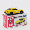 A yellow MF Ghost sports car model from Dream Tomica in a box.