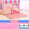Pink and purple foldable kids play tent with a striped fabric and a pink mat on a wooden floor.
