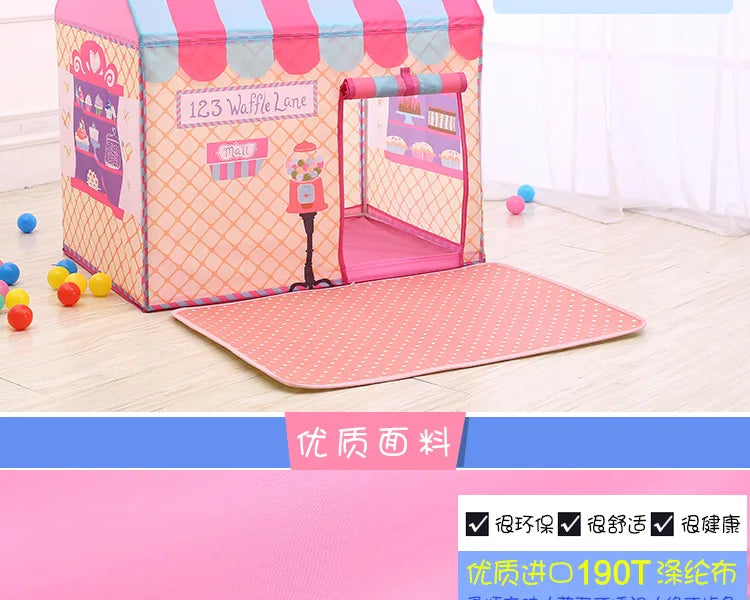 Pink and purple foldable kids play tent with a striped fabric and a pink mat on a wooden floor.