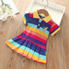 A colorful kids summer dress featuring horizontal rainbow stripes and a rabbit embroidery detail.