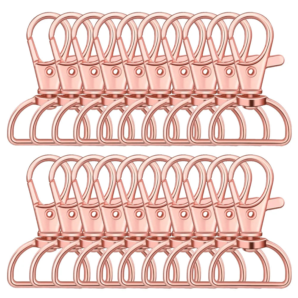 A pink 30-pack of swivel snap hooks with D-rings for keychains, bags, and craft projects.