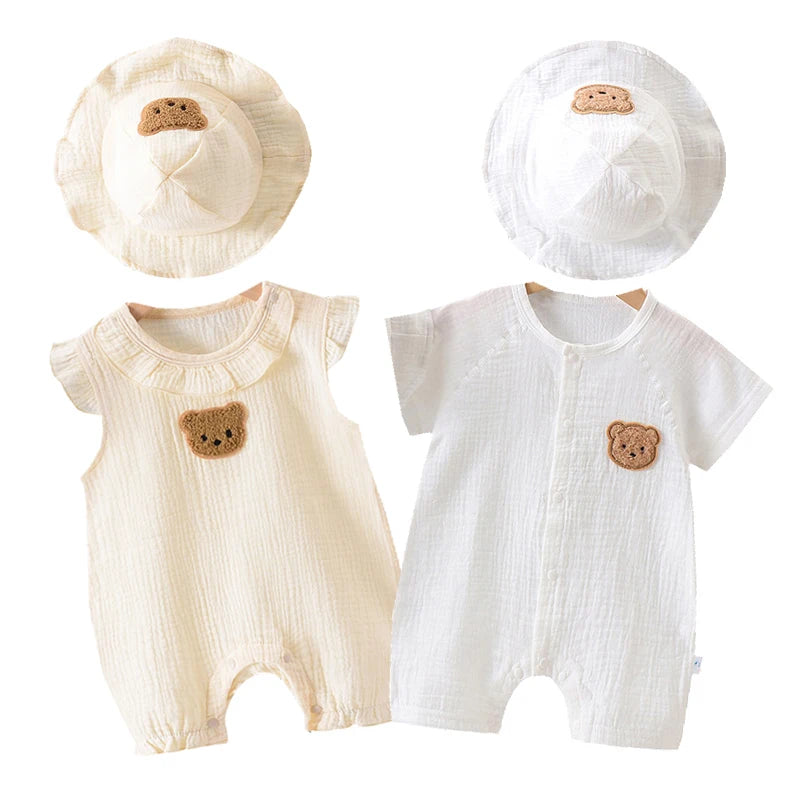 A white cotton muslin baby romper and hat set for summer, featuring a textured fabric.