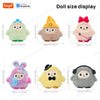 A collection of various doll-sized plush robots with different colors and expressions.