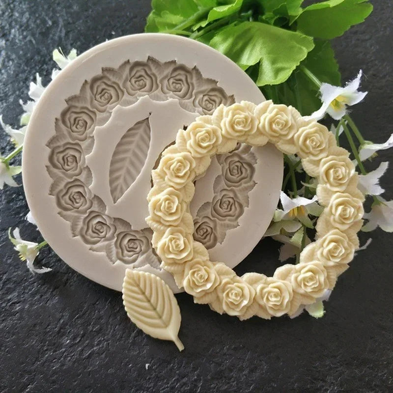 A silicone mold featuring rosette leaves and a wreath design for cake and chocolate decorating.