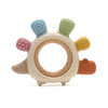 A silicone baby teether shaped like a rudder with a wooden ring and various colored silicone protrusions.