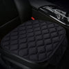 Black quilted anti-slip car seat cushion set placed in a car interior
