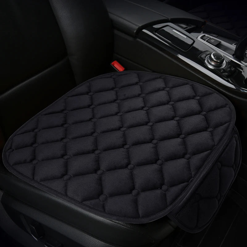 Black quilted anti-slip car seat cushion set placed in a car interior