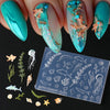 A set of silicone nail art molds featuring ocean themes like fish, starfish, and sea creatures on a clear plastic sheet.