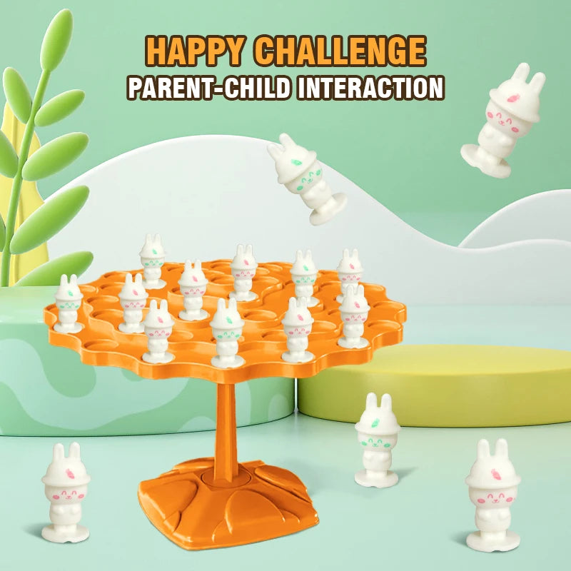 An orange frog balance tree math game with small white frog figures and a green plant in a light green background.