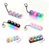 A set of keyboard keychain fidget toys featuring colorful silicone buttons and LED lights.