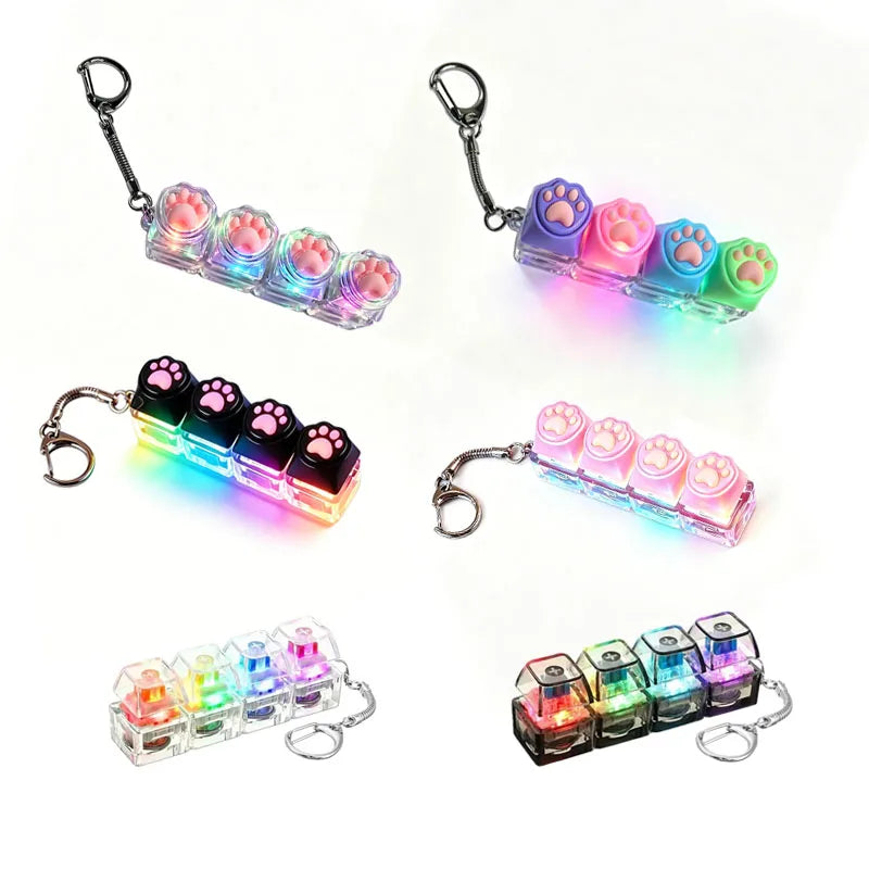A set of keyboard keychain fidget toys featuring colorful silicone buttons and LED lights.