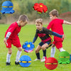 A collection of colorful squeeze-and-throw flying saucer balls in blue, red, and green are scattered on a grassy field with c