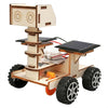 A wooden model kit of a solar-powered lunar rover featuring a boxy body and four wheels.