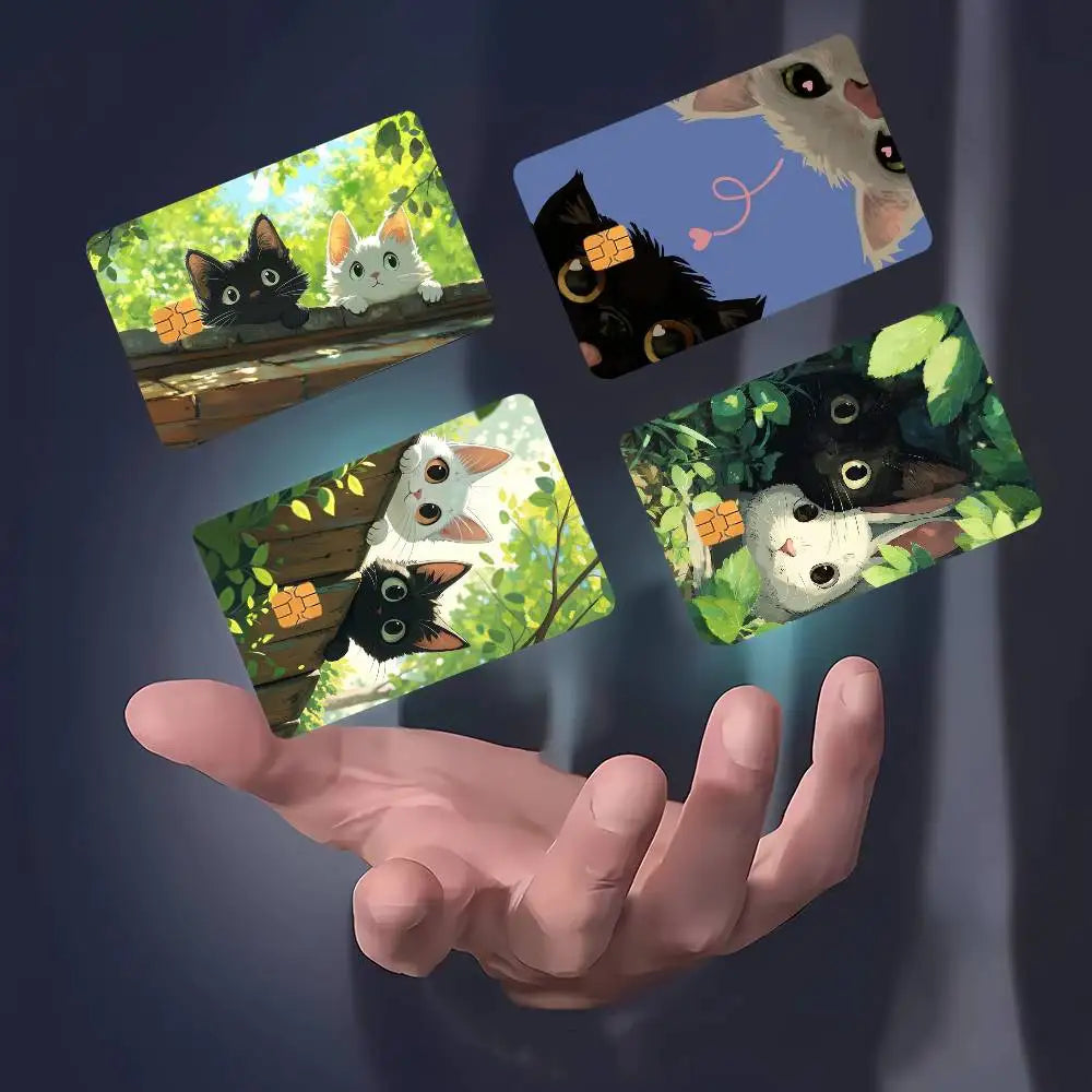 A hand holds several stickers featuring cute black and white cats on a green background.