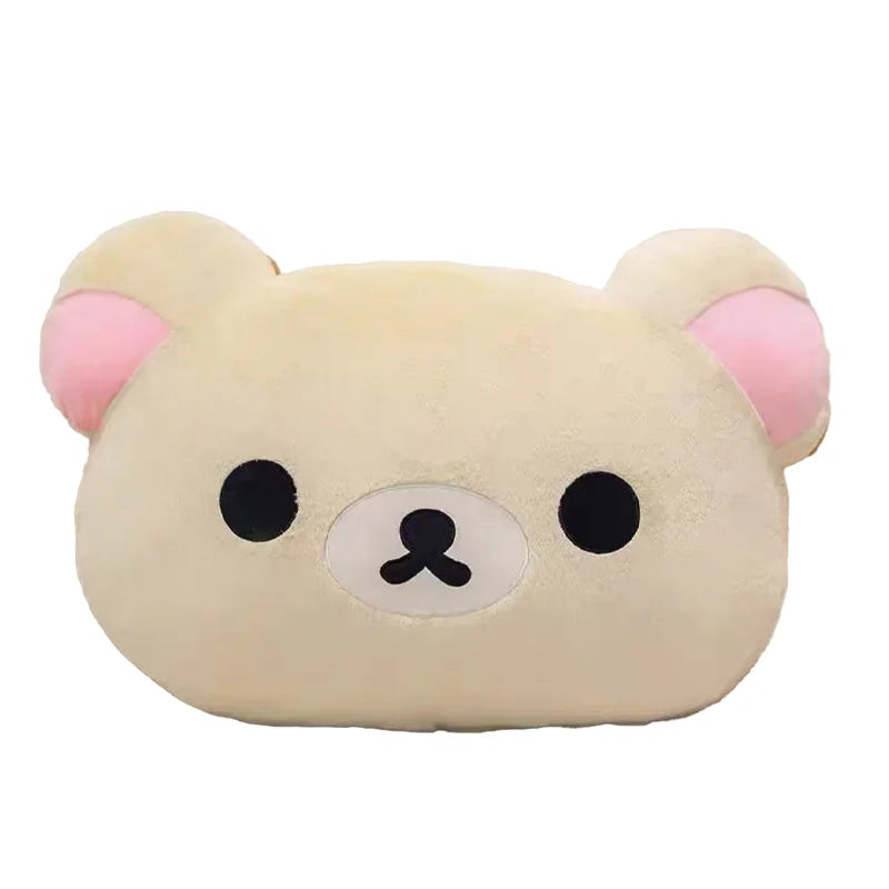 A soft plush pillow shaped like Rilakkuma with light beige fur and pink ears.