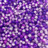 A close-up view of round glass crackle beads in various shades of purple and iridescent white.