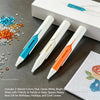 Three vibrant colored paint pens are displayed next to a diamond painting grid and a white box.