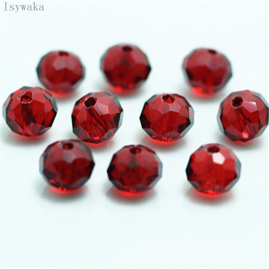 A collection of round, faceted red crystal glass beads used for jewelry making.
