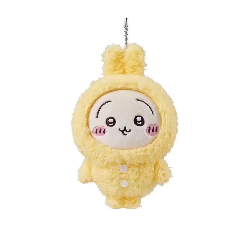 A yellow plush keychain of Usagi Hachiware with a pajama theme face.