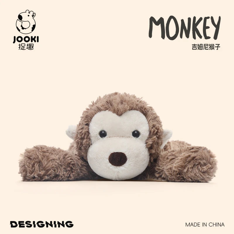 A fluffy brown monkey plush toy with a white face is shown against a light background.