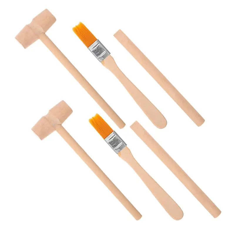 A set of three tools for a dinosaur excavation kit including a wooden hammer, chisel, and brush.