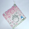 A pink plush toy featuring a cute cat design and a small blue animal on a white background.
