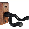 A black, curved wall mount hanger made of wood, designed to hold stringed instruments.