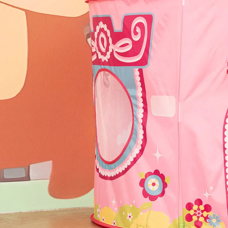 A pink pop-up play tent featuring a rocket ship design with colorful floral accents.
