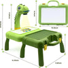 A green kids drawing projector with a screen and a stand is shown, along with its accompanying carrying case.