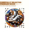 A jigsaw puzzle featuring a cat sleeping on a wooden background surrounded by various animal shapes.