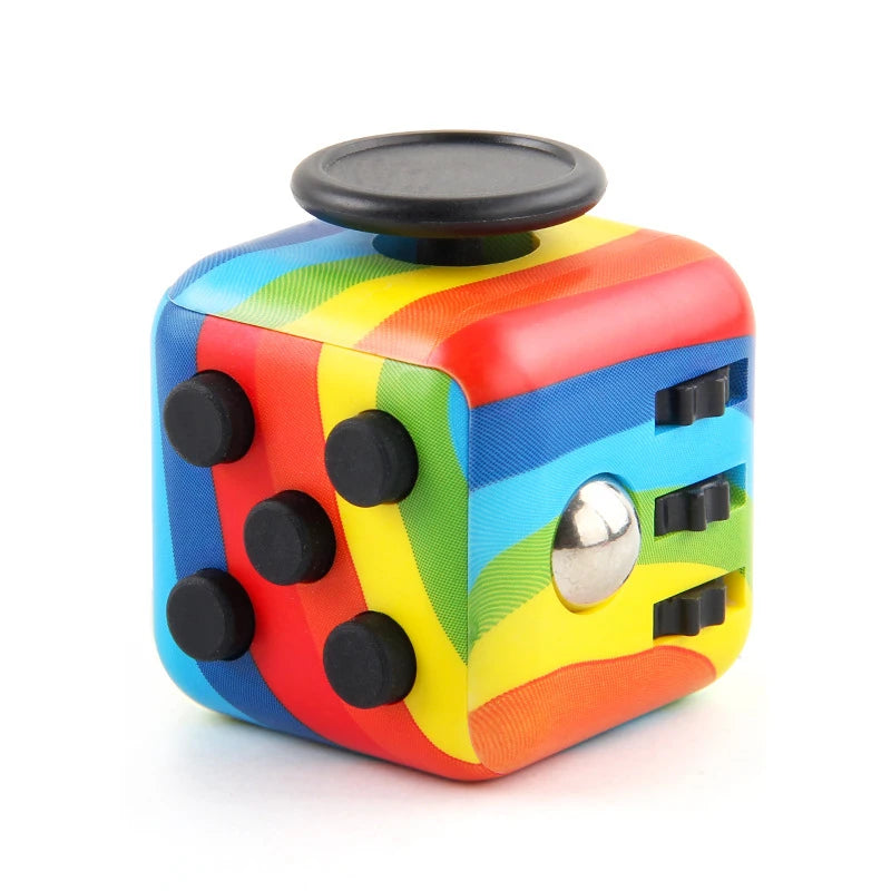 A colorful fidget cube with a rotating joystick and magnetic buttons, featuring rainbow stripes on the body.